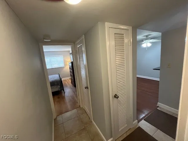 a view of a bathroom from a corridor