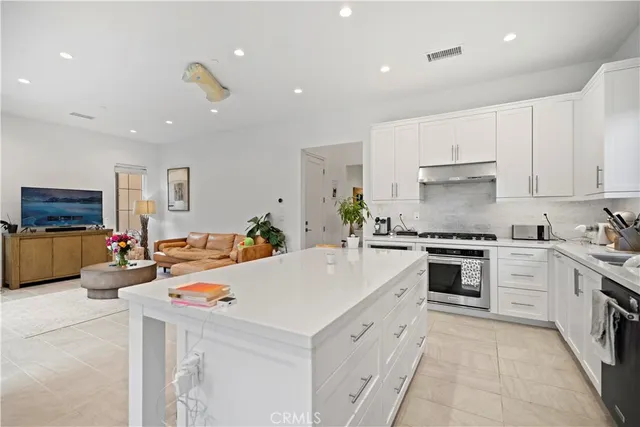 a very nice looking living room with a large window