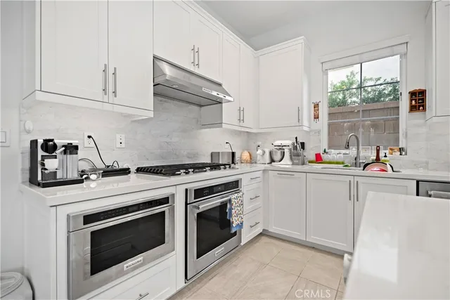 a view of a dining room with furniture and a large window