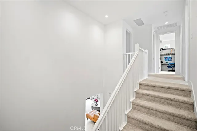 a view of staircase with white walls