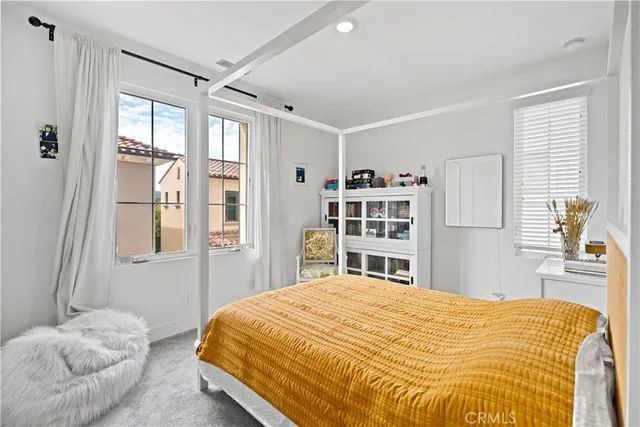 a white toilet sitting next to a bath tub