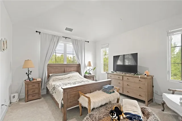 a bedroom with a bed and a cabinets