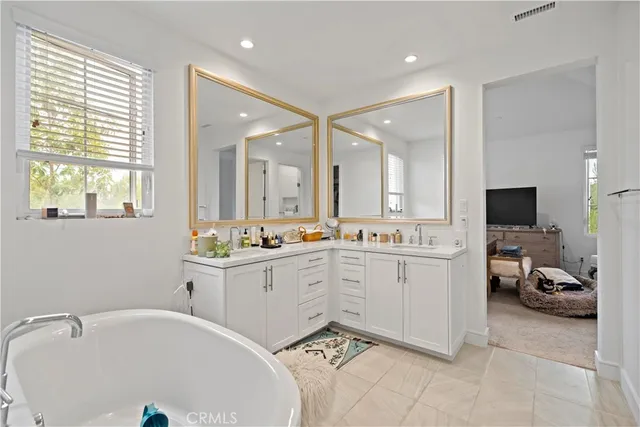 a bathroom with a toilet sink a shower and a bathtub