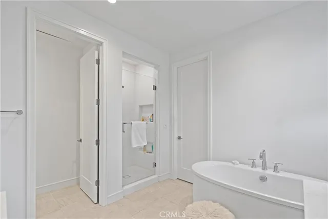 an aerial view of multiple houses with a yard