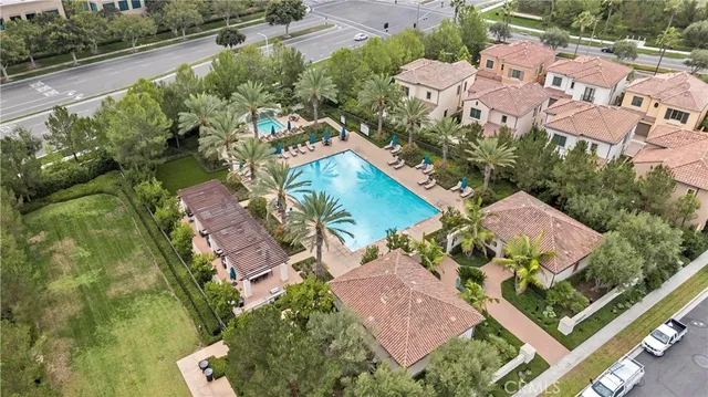 an aerial view of residential house with outdoor space and parking