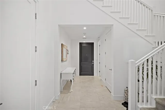 a view of a hallway with white walls