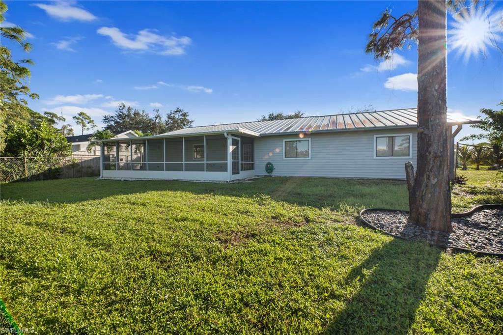 18262 Huckleberry Road Fort Myers, FL 33967 - Photo 15 of 19 front view of a house with a yard