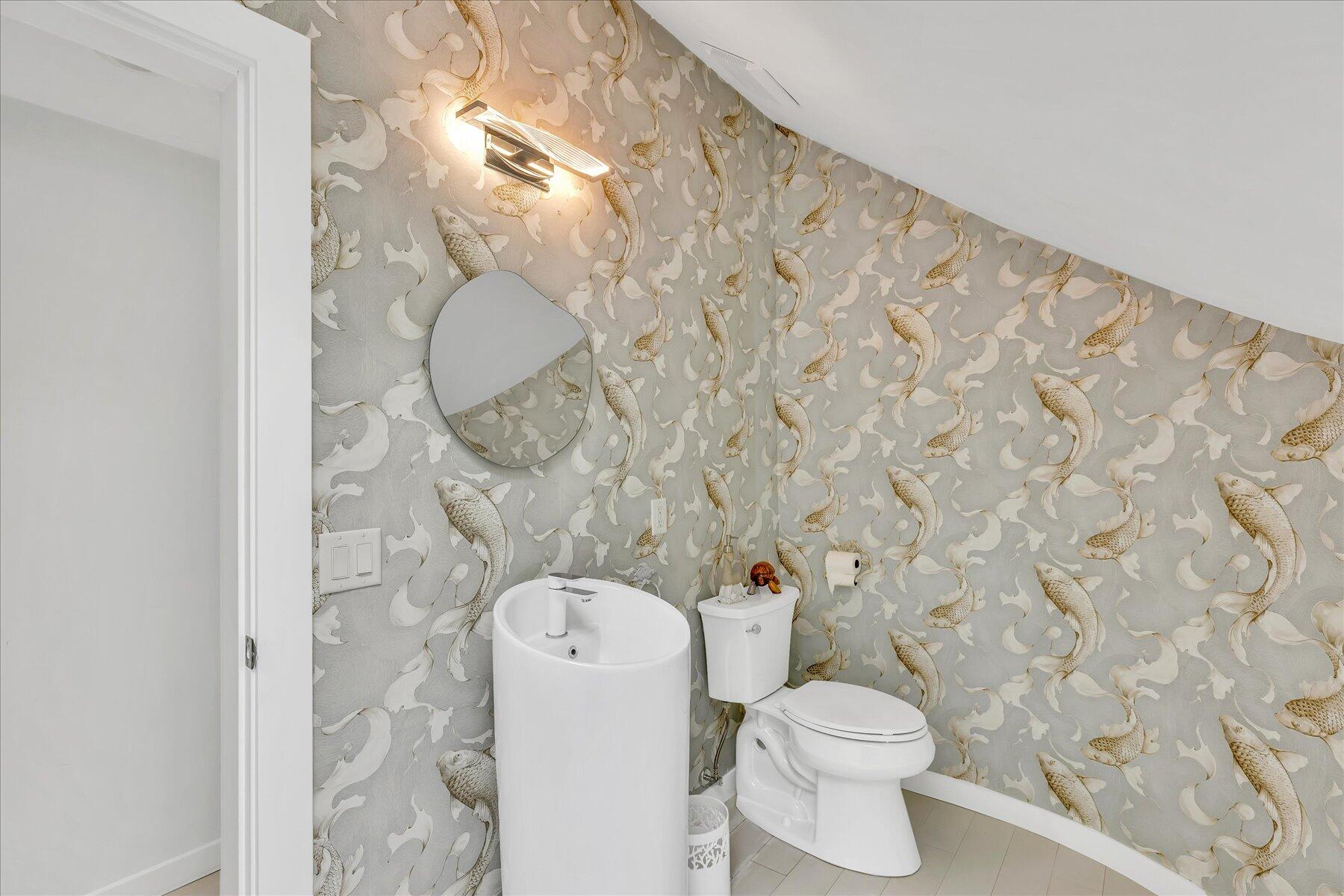 50 Topping Lift Mashpee, MA 02649 - Photo 34 of 34 a white toilet sitting next to a shower curtain