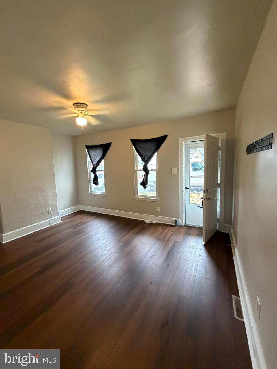 135 9th Street Brookhaven, PA 19015 - Photo 2 of 9 an empty room with wooden floor and windows