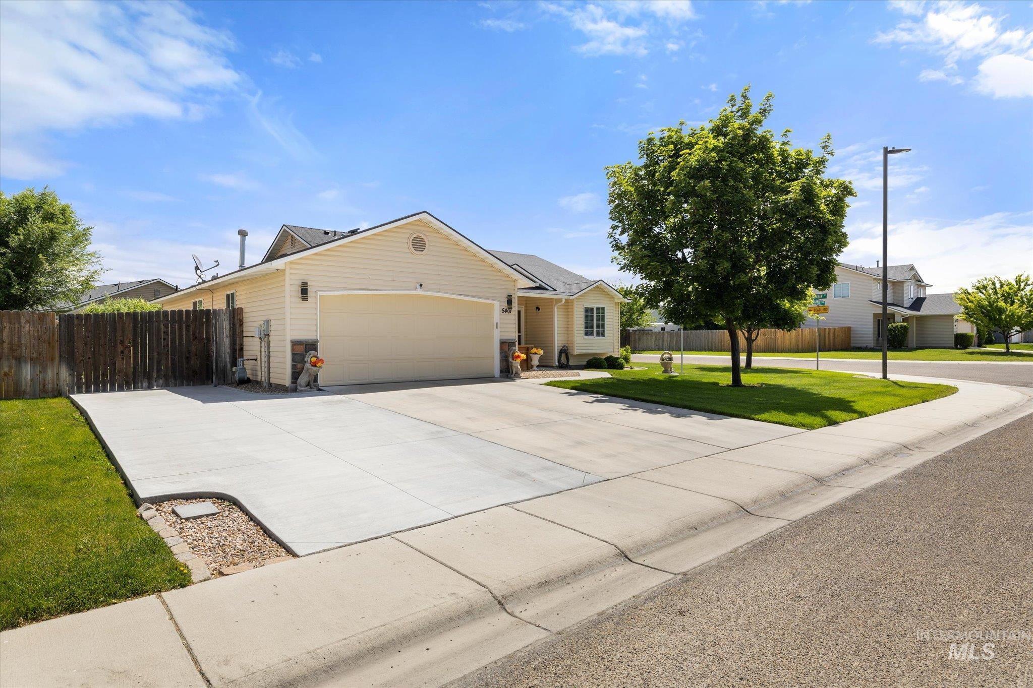 5401 Barkley Way Caldwell, ID 83607 - Photo 2 of 35 Single-story residence featuring light-toned siding and a prominent two-car garage