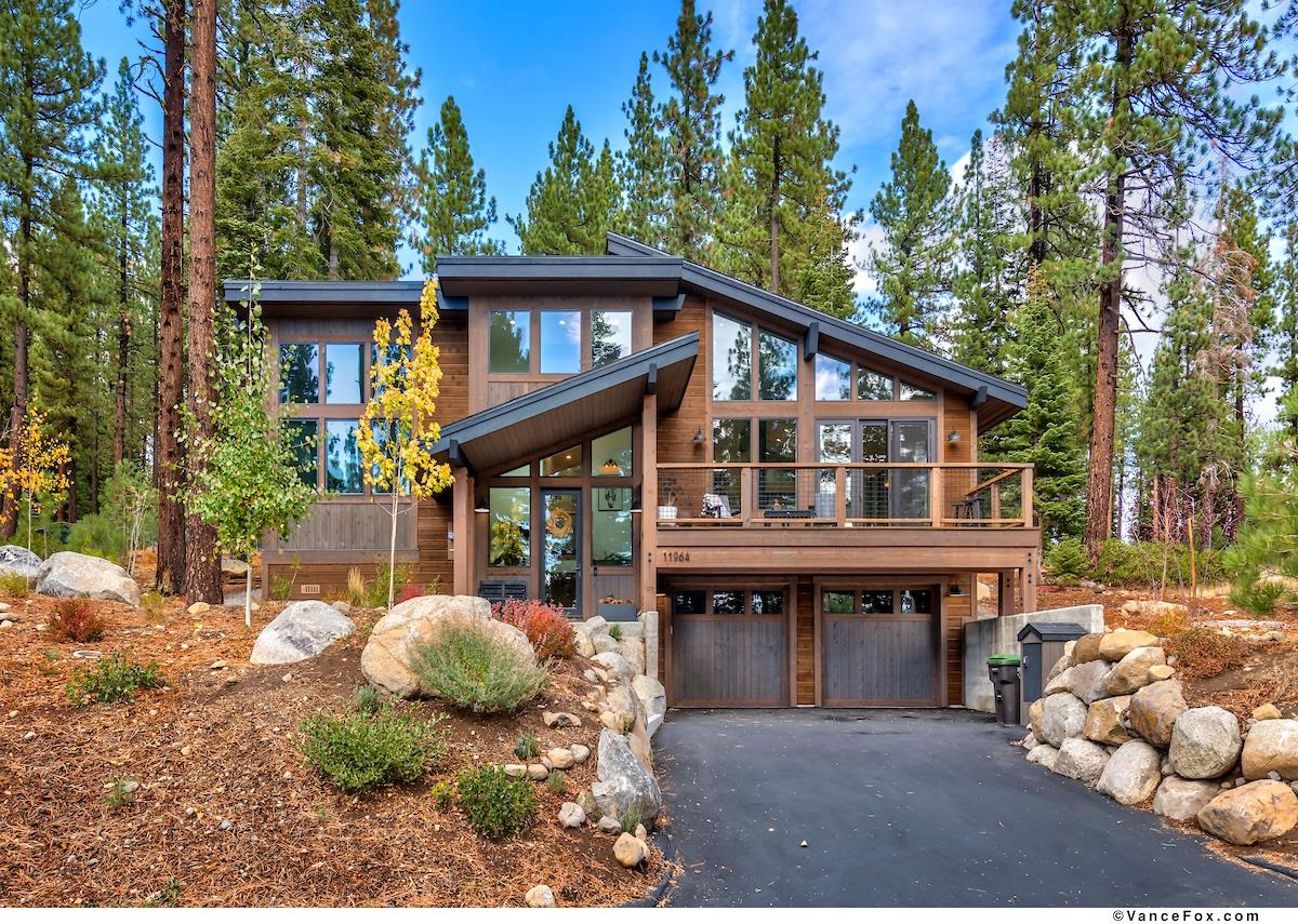11964 Cavern Way Truckee, CA 96161 - Photo 1 of 21 a front view of a house with garden
