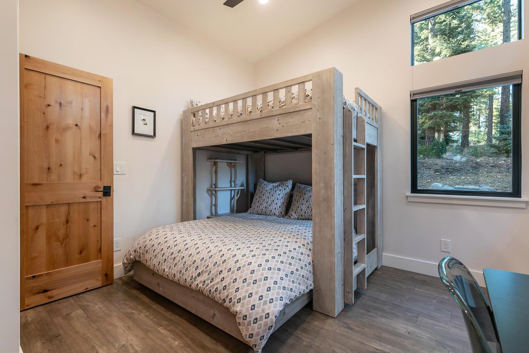 11964 Cavern Way Truckee, CA 96161 - Photo 11 of 21 a bedroom with a large bed and a window