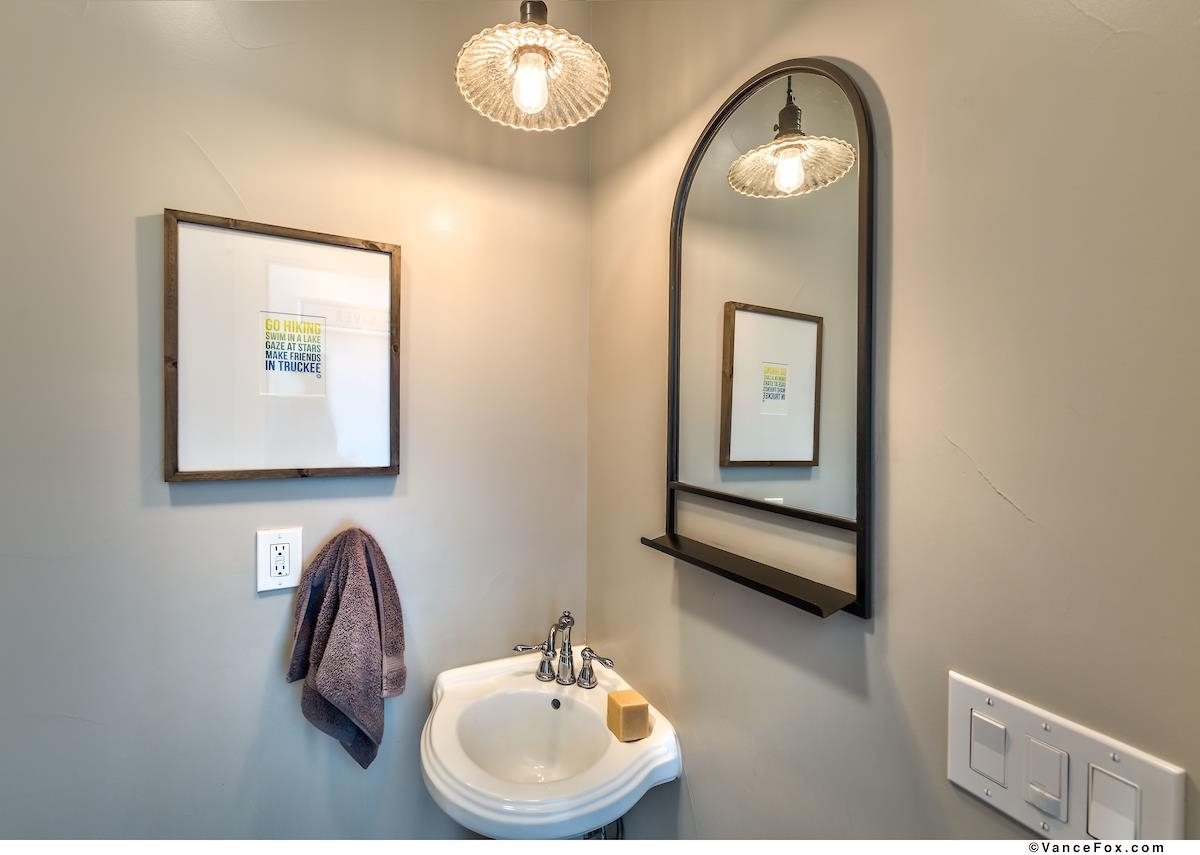 11964 Cavern Way Truckee, CA 96161 - Photo 14 of 21 a bathroom with a sink and mirror