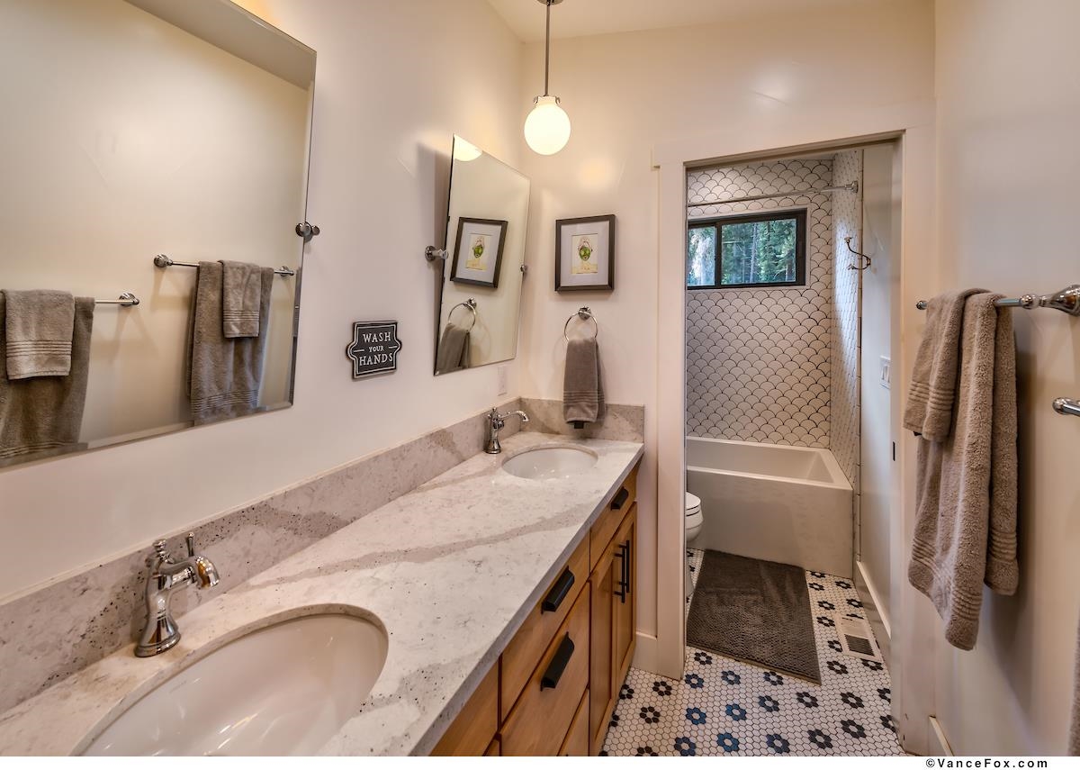 11964 Cavern Way Truckee, CA 96161 - Photo 15 of 21 a bathroom with a tub sink and a mirror