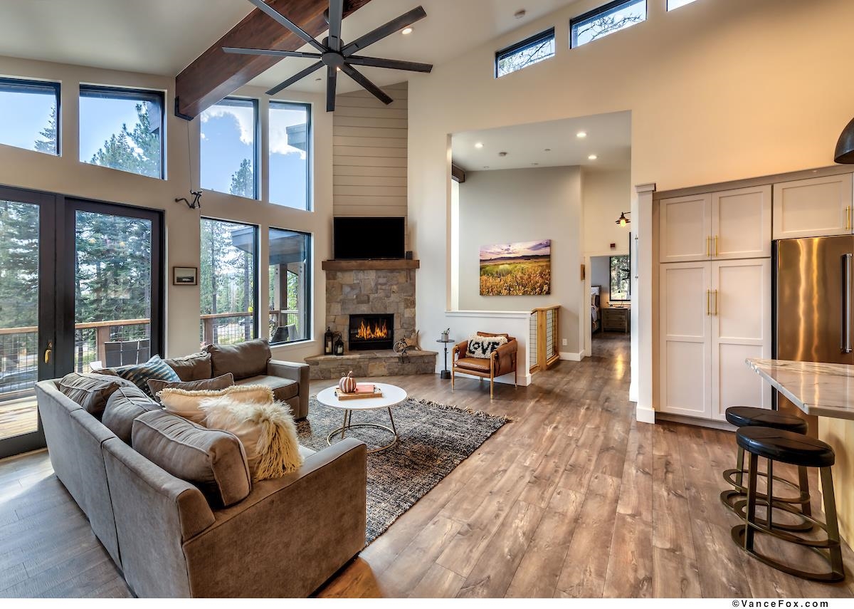 11964 Cavern Way Truckee, CA 96161 - Photo 6 of 21 a living room with furniture fireplace and a large window