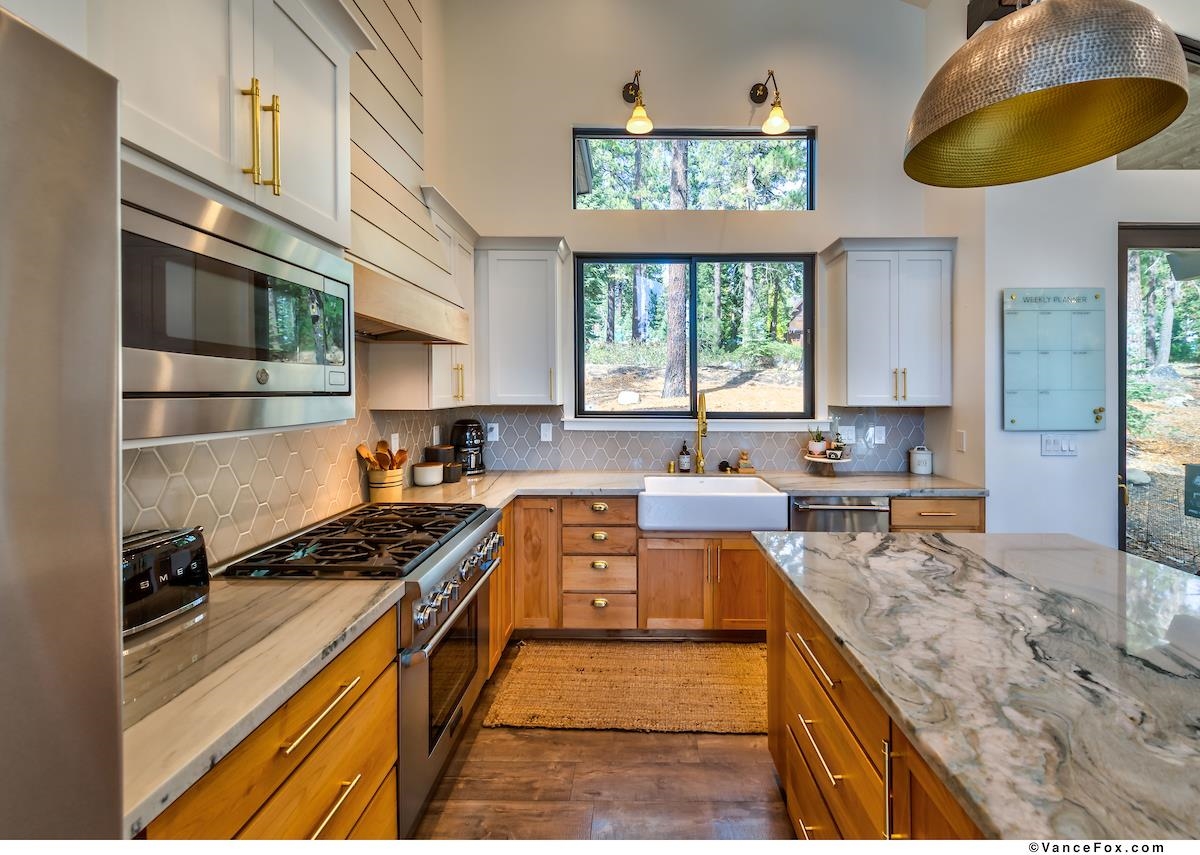 11964 Cavern Way Truckee, CA 96161 - Photo 9 of 21 a kitchen with stainless steel appliances granite countertop a stove a sink and a microwave