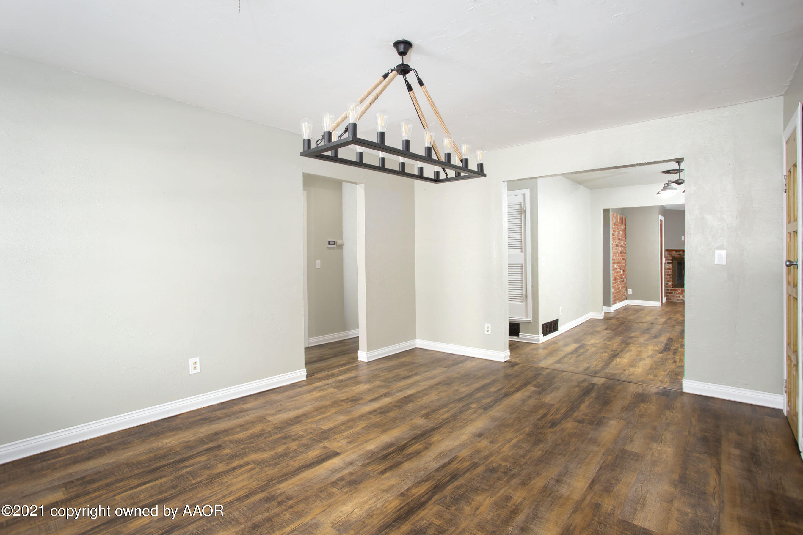 a view of a chandelier in an empty room