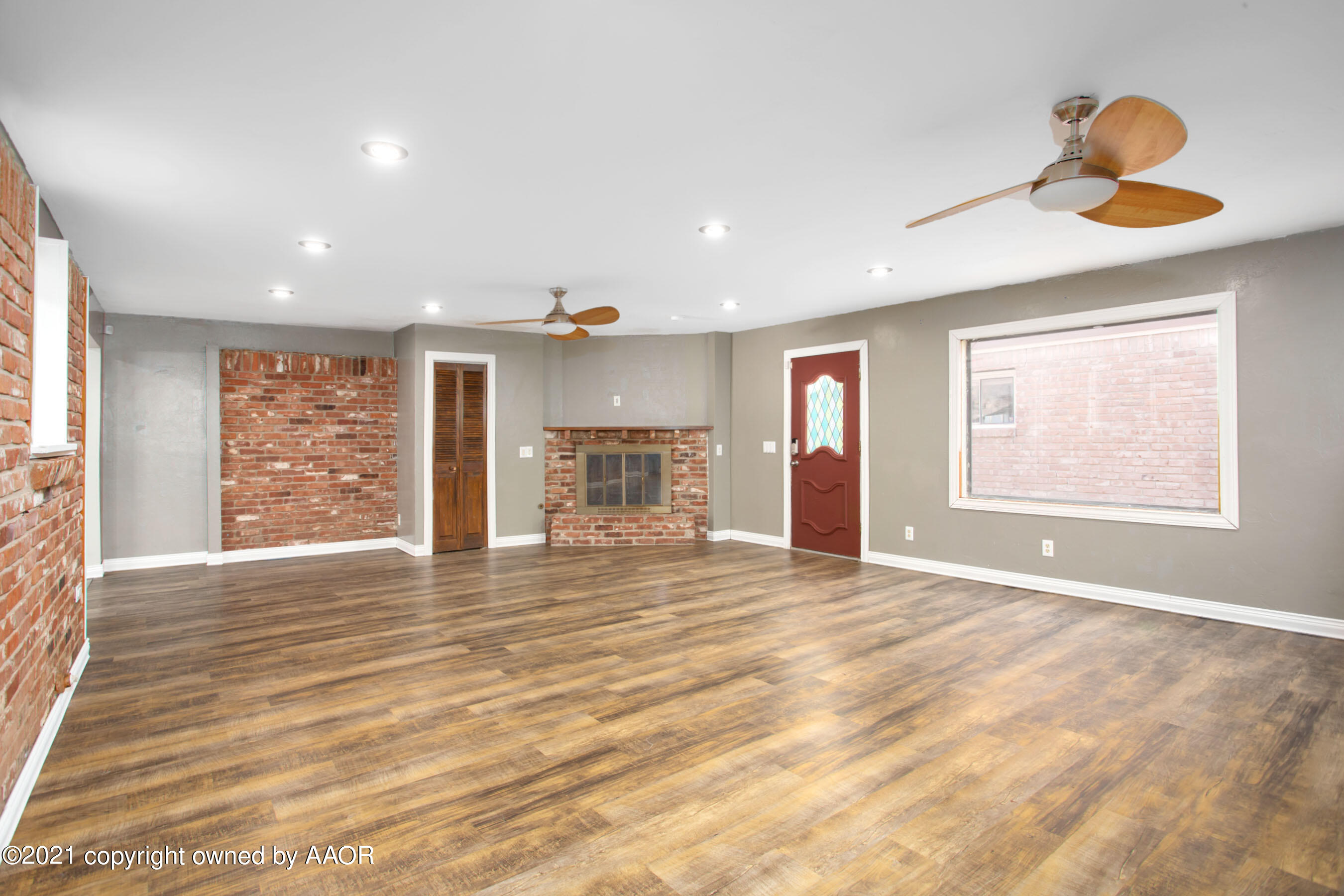 4313 Summit Circle Amarillo, TX 79109 - Photo 11 of 24 a view of an empty room with wooden floor and a window