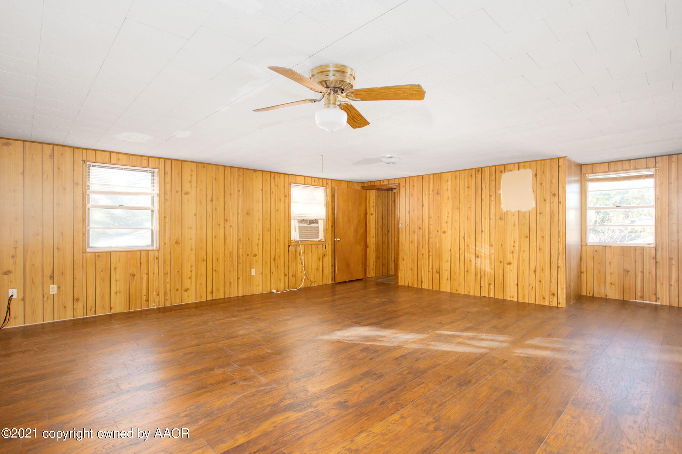 4313 Summit Circle Amarillo, TX 79109 - Photo 13 of 24 wooden floor in an empty room with a window