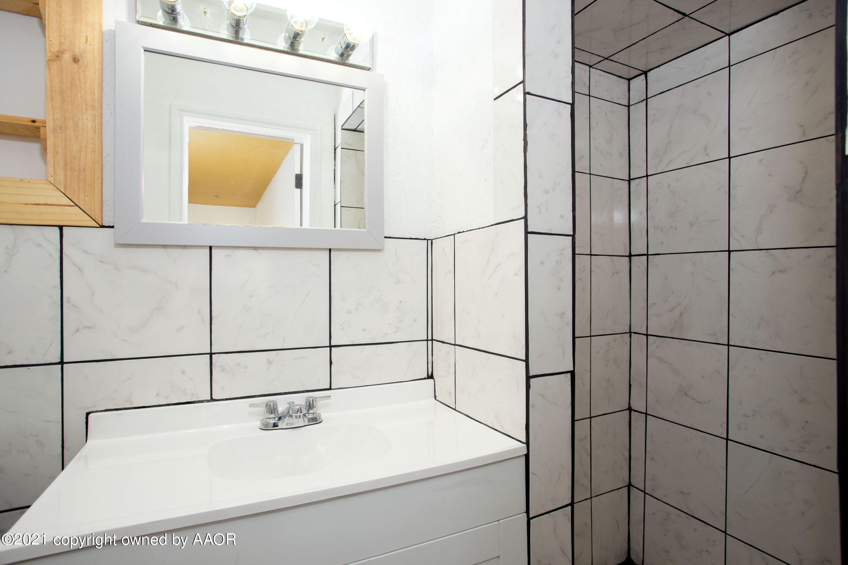 4313 Summit Circle Amarillo, TX 79109 - Photo 18 of 24 a bathroom with a sink and a mirror
