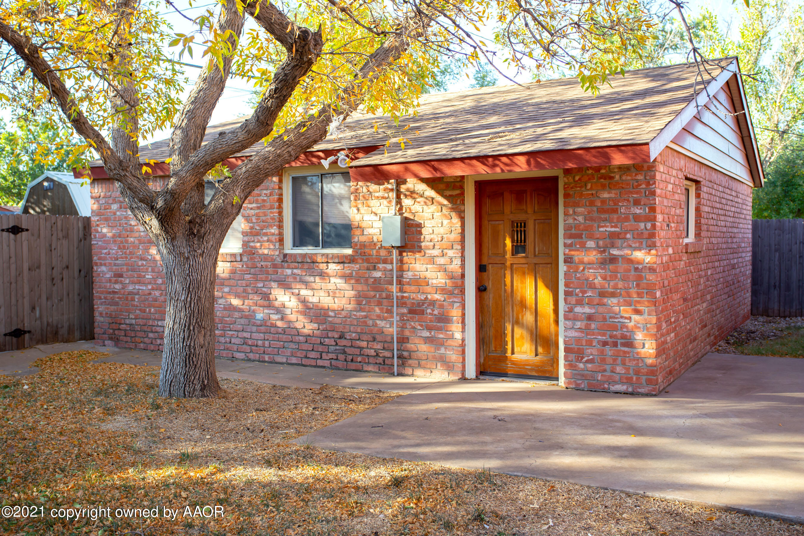 4313 Summit Circle Amarillo, TX 79109 - Photo 22 of 24 a front view of a house with a yard and garage