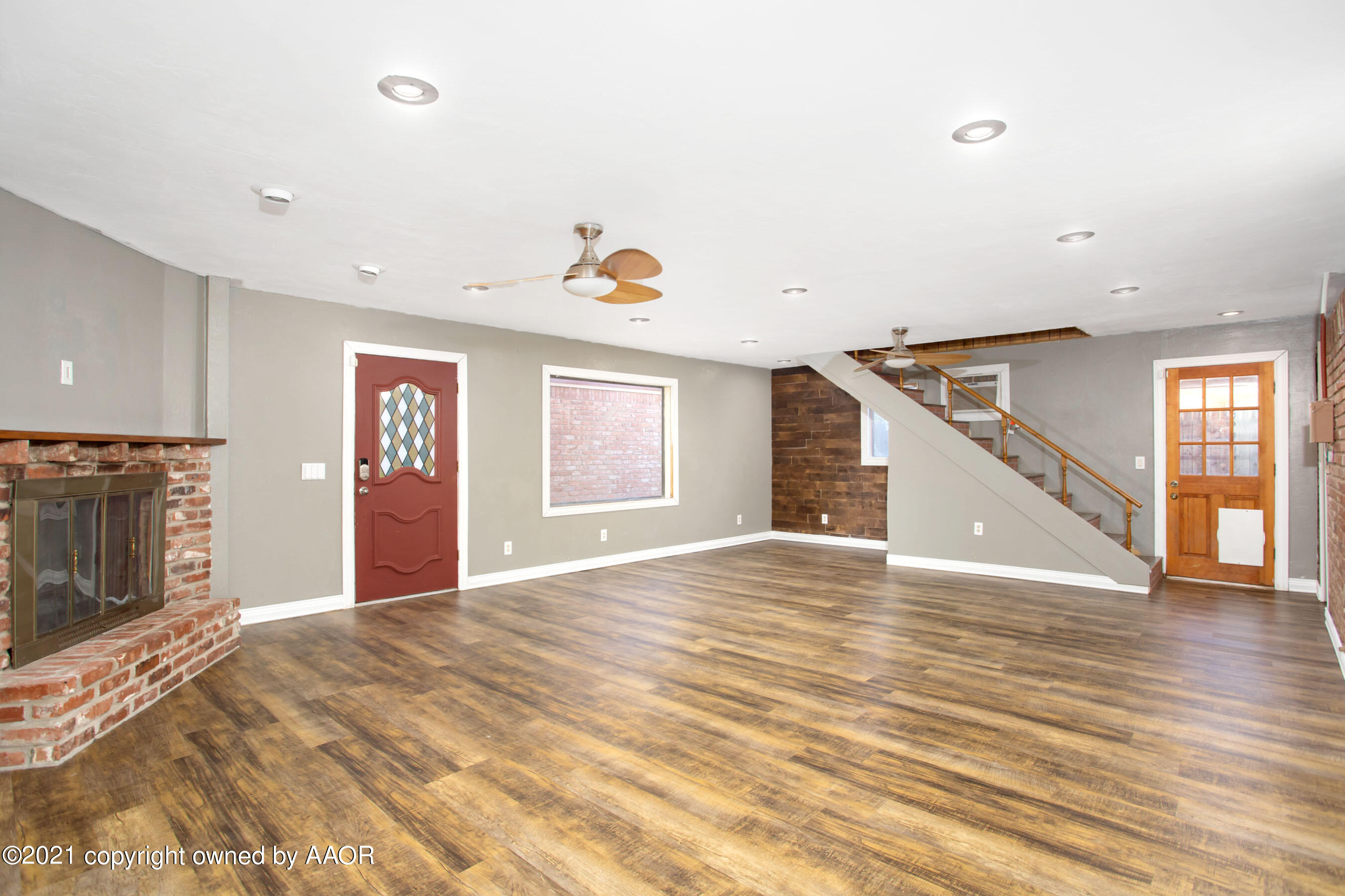 4313 Summit Circle Amarillo, TX 79109 - Photo 8 of 24 a view of an empty room with wooden floor and a window