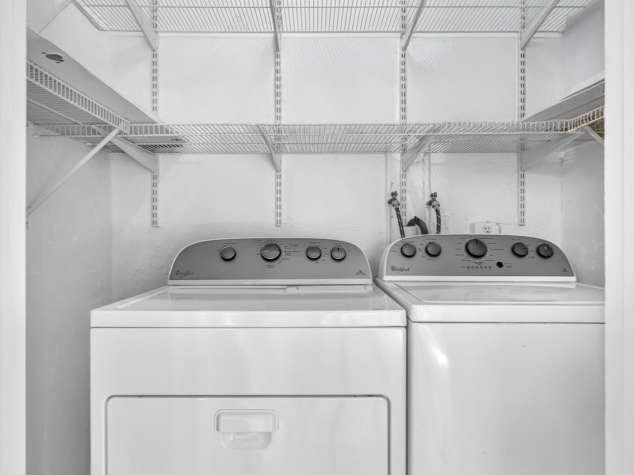 524 Osprey Drive, Unit 11B Delray Beach, FL 33444 - Photo 23 of 54 a utility room with dryer and washer