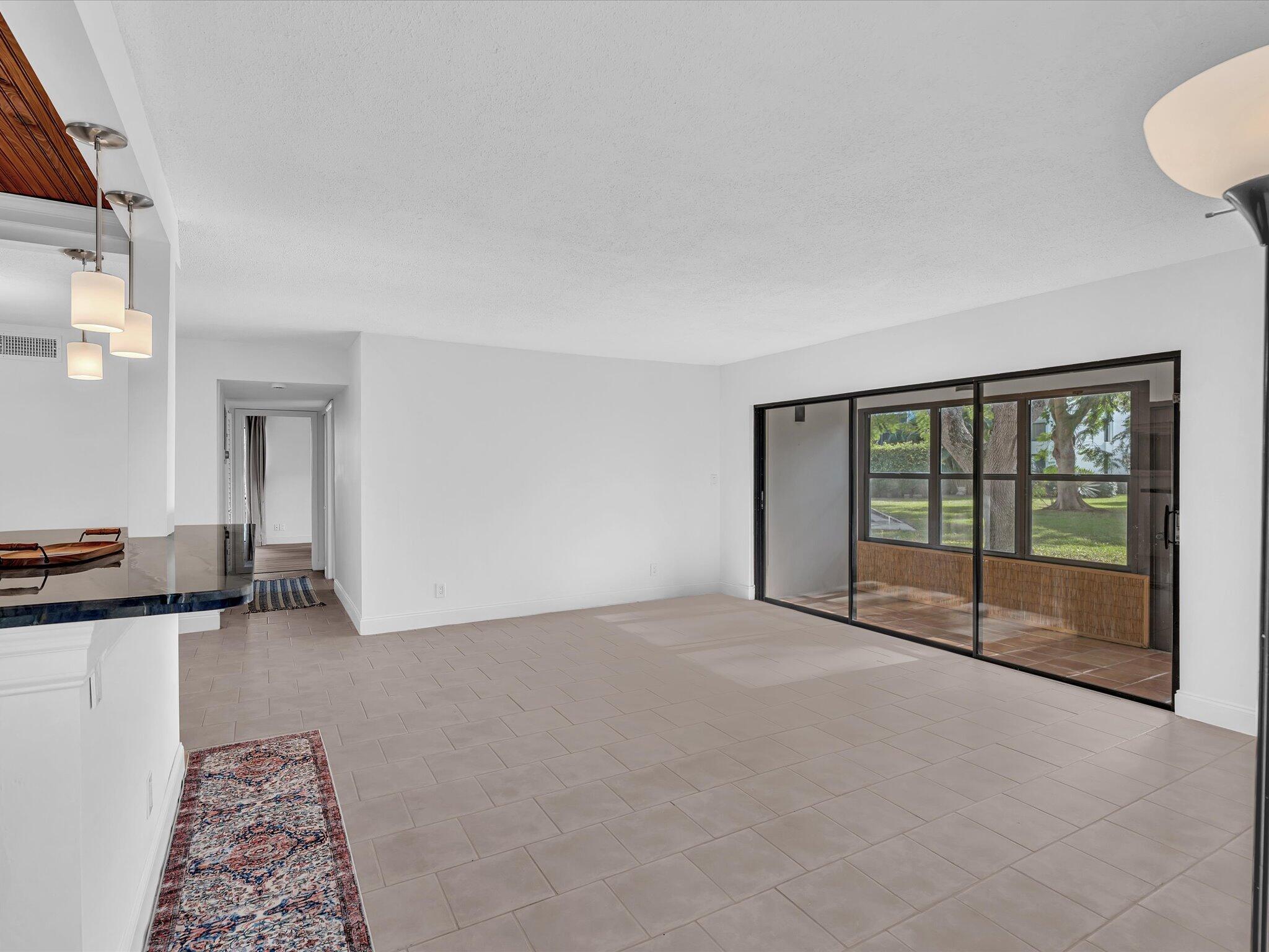 524 Osprey Drive, Unit 11B Delray Beach, FL 33444 - Photo 3 of 54 a view of an empty room with a window
