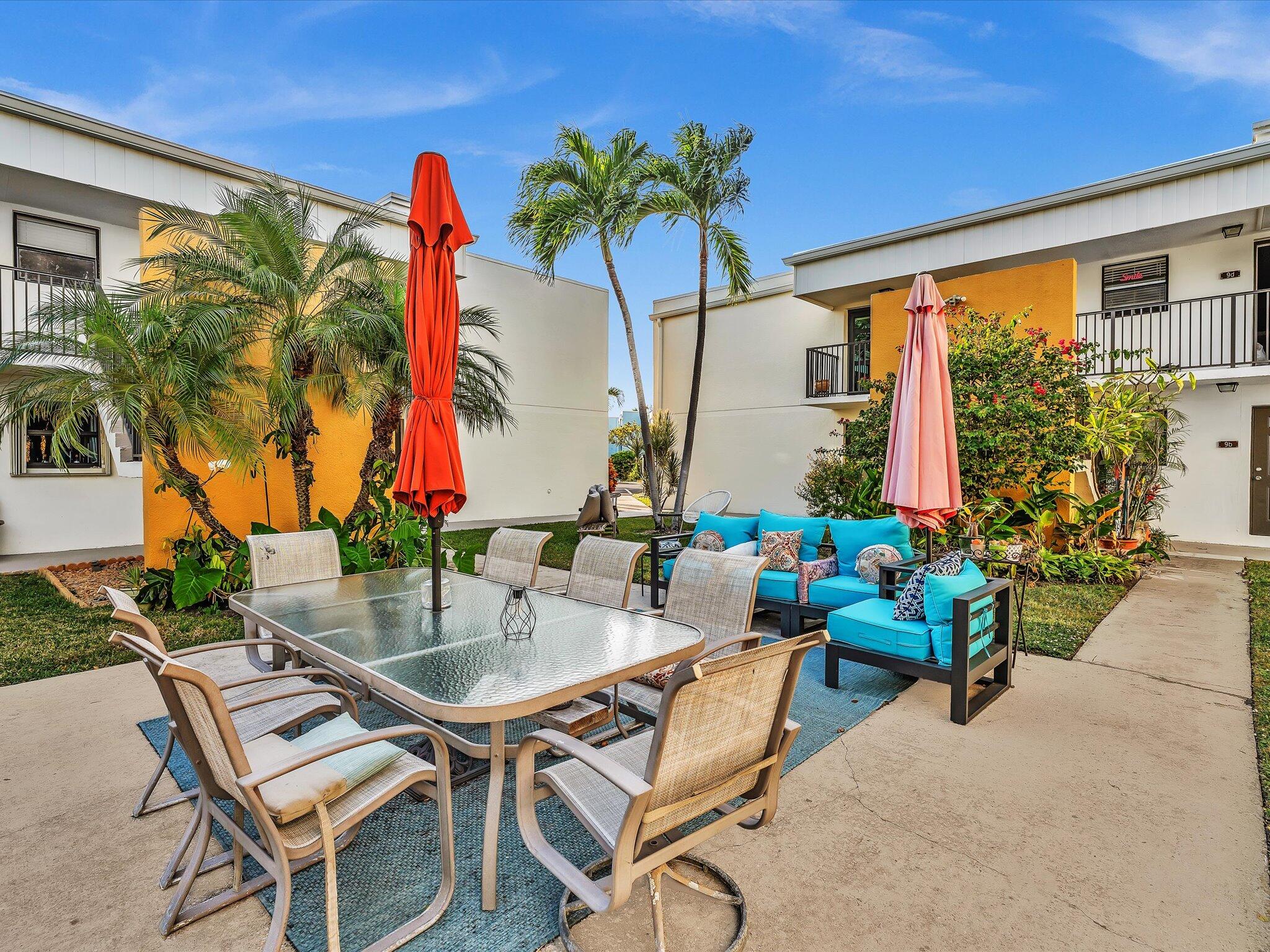 524 Osprey Drive, Unit 11B Delray Beach, FL 33444 - Photo 40 of 54 a view of a chairs and table in the patio