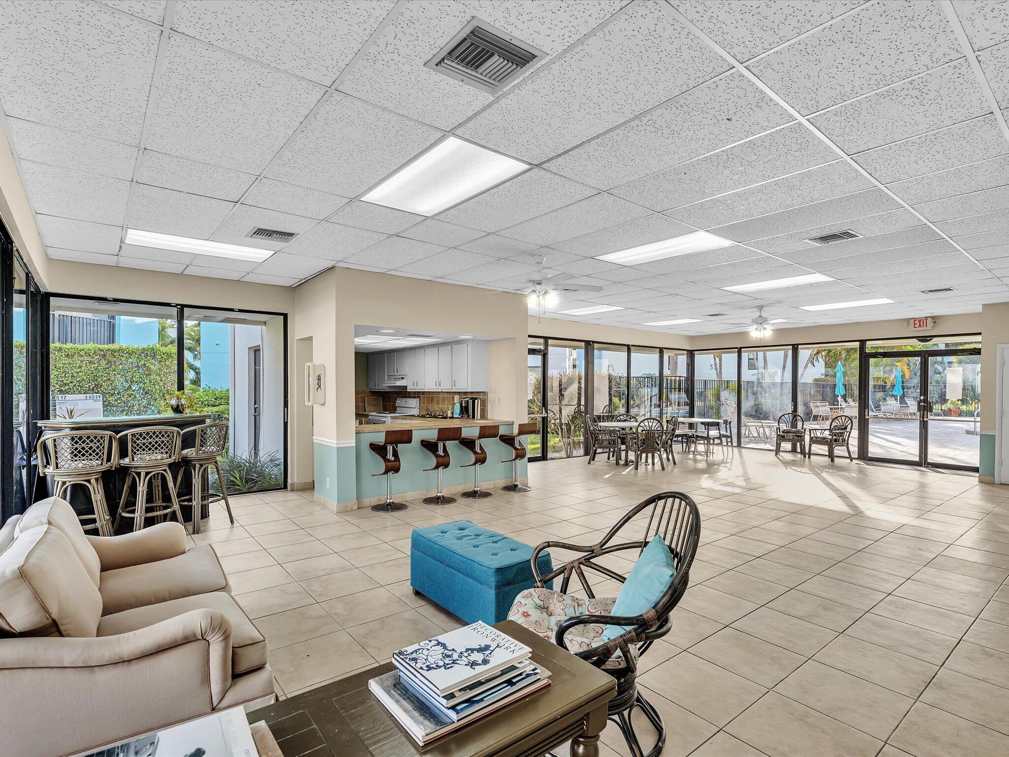524 Osprey Drive, Unit 11B Delray Beach, FL 33444 - Photo 45 of 54 a living room with furniture and a flat screen tv