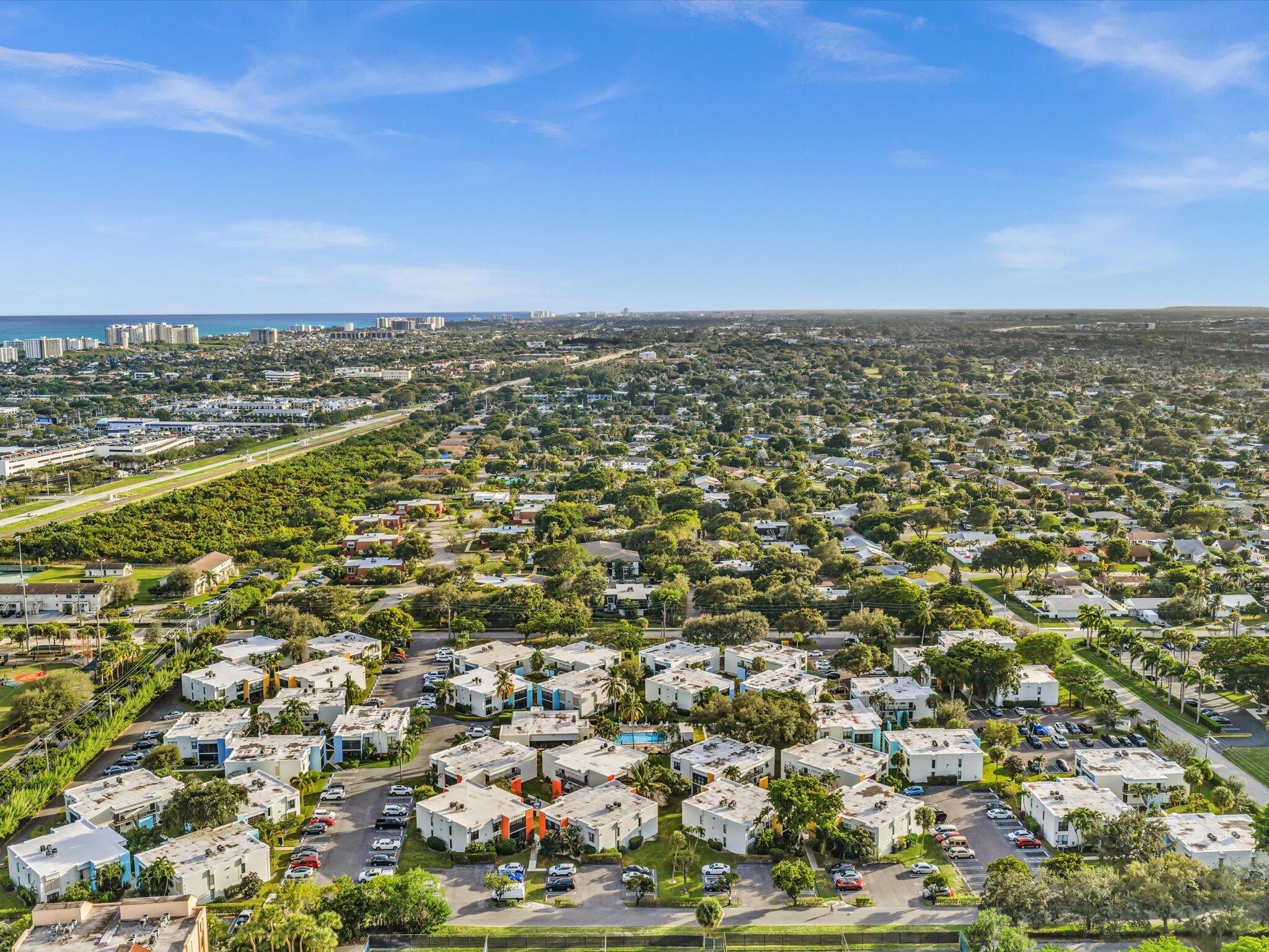 524 Osprey Drive, Unit 11B Delray Beach, FL 33444 - Photo 49 of 54 an aerial view of residential houses with outdoor space