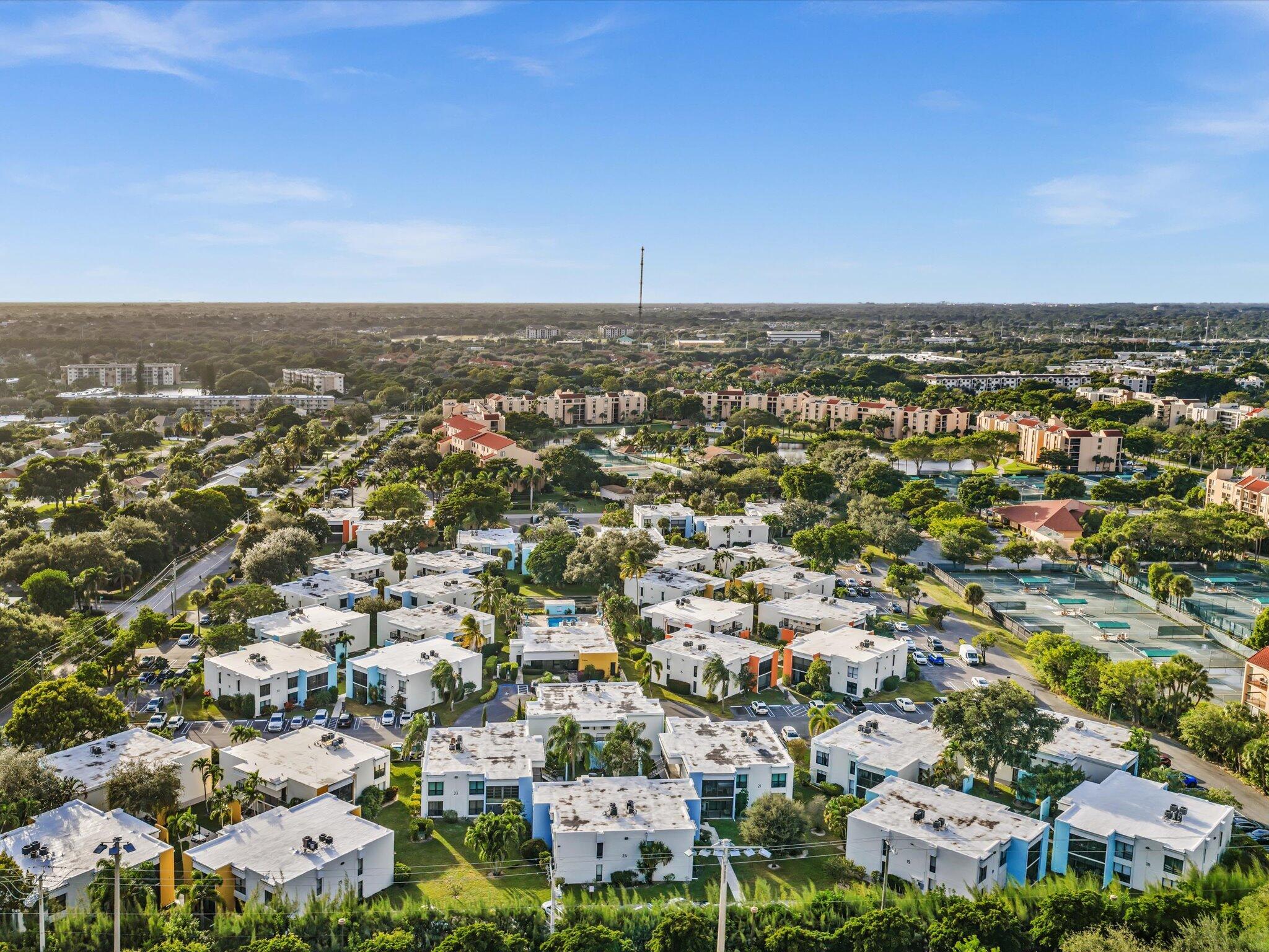 524 Osprey Drive, Unit 11B Delray Beach, FL 33444 - Photo 52 of 54 an aerial view of a city with lots of residential buildings
