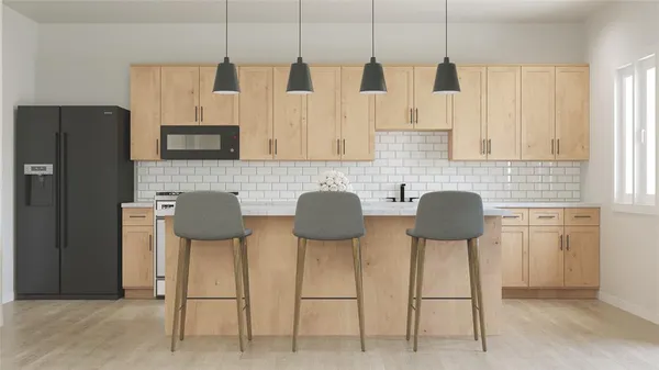 a view of kitchen with cabinets