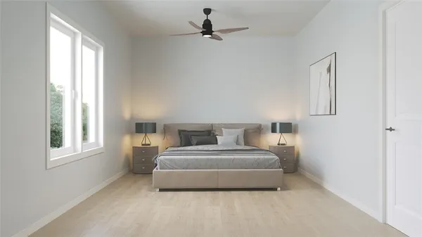 a bedroom with a bed and a window