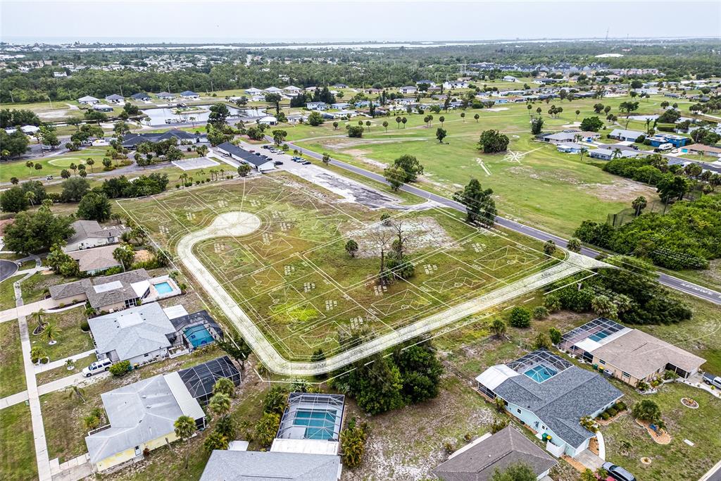 3 Golfview Road Rotonda West, FL 33947 - Photo 6 of 13 an aerial view of residential houses with outdoor space