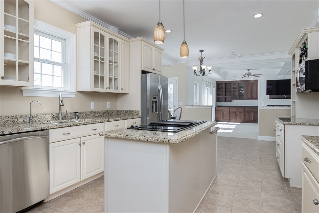 16 Mountain Laurel Road Ayer, MA 01432 - Photo 13 of 39 a kitchen with kitchen island granite countertop a sink cabinets and stainless steel appliances