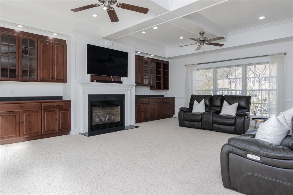 16 Mountain Laurel Road Ayer, MA 01432 - Photo 14 of 39 a living room with furniture fireplace and flat screen tv
