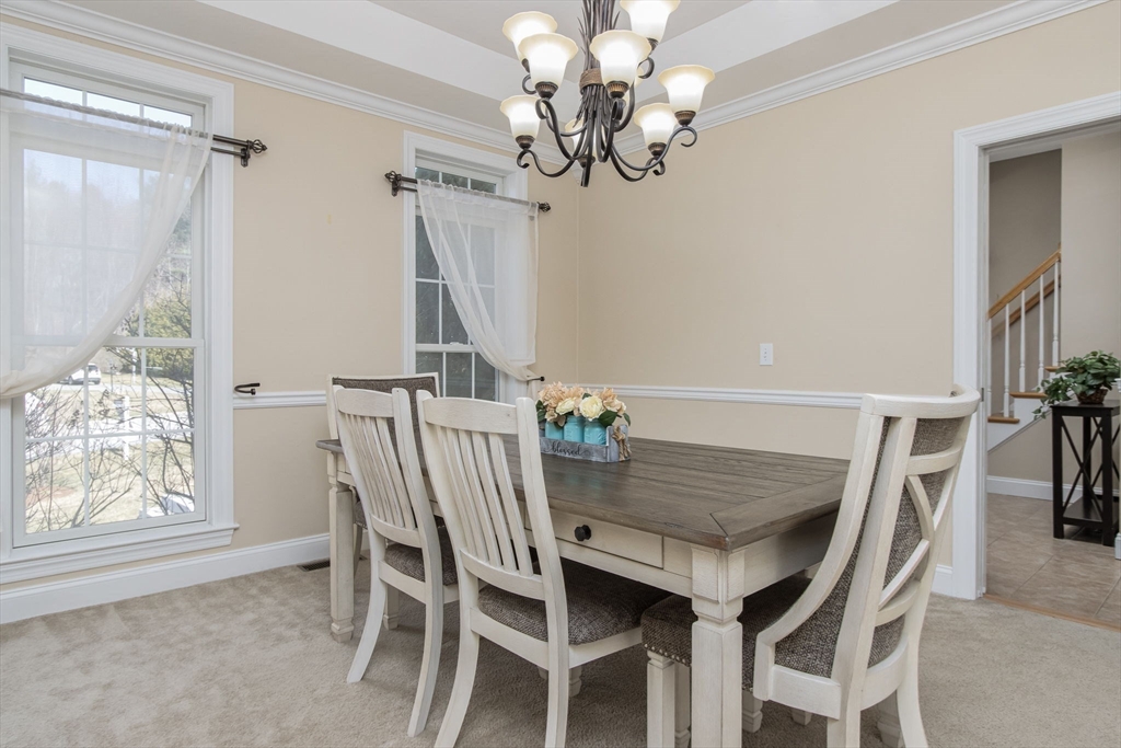 16 Mountain Laurel Road Ayer, MA 01432 - Photo 16 of 39 a view of a dining room with furniture window and wooden floor