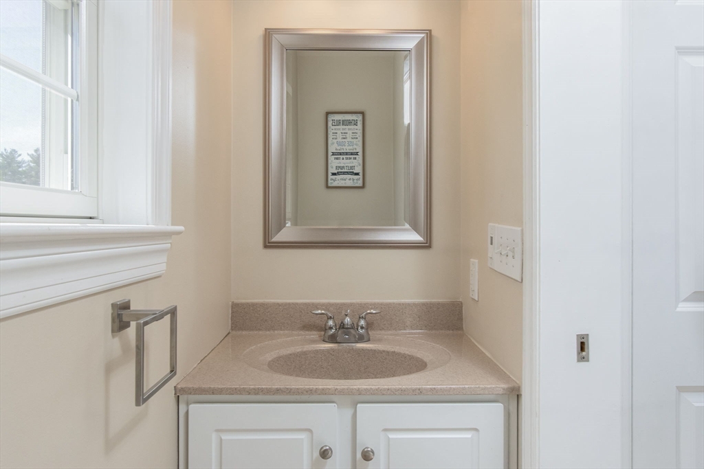 16 Mountain Laurel Road Ayer, MA 01432 - Photo 18 of 39 a bathroom with a granite countertop sink and a mirror