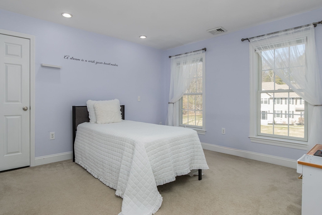 16 Mountain Laurel Road Ayer, MA 01432 - Photo 27 of 39 a bedroom with a bed and window