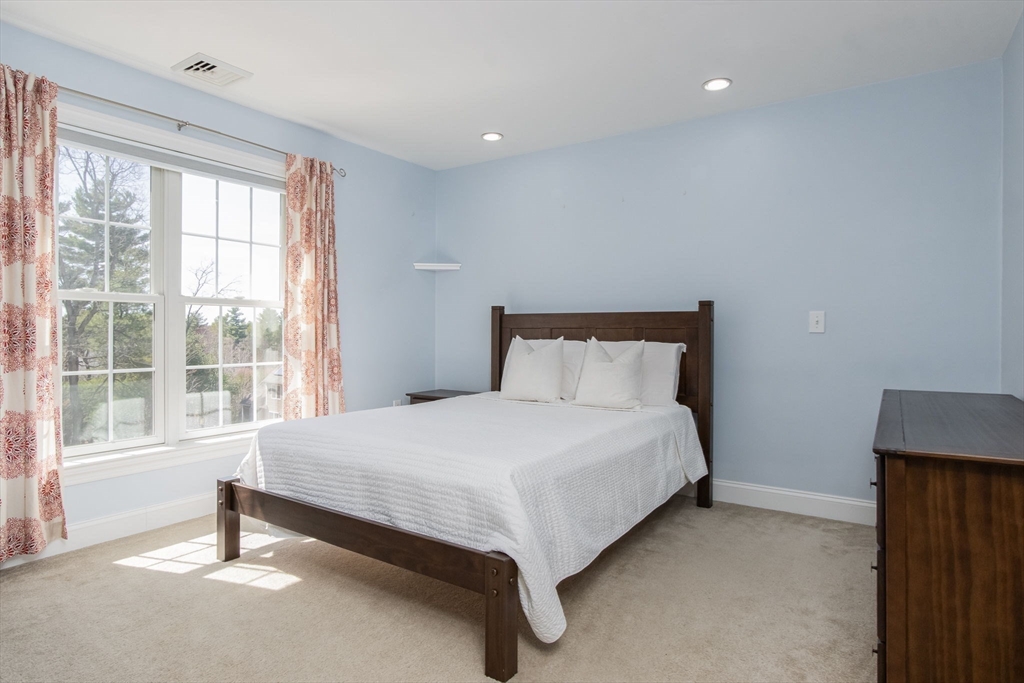 16 Mountain Laurel Road Ayer, MA 01432 - Photo 28 of 39 a large bed sitting in a bedroom next to a window