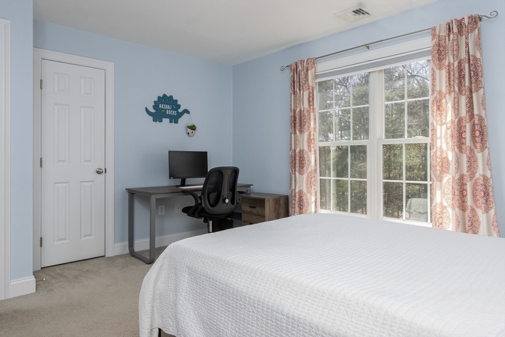 16 Mountain Laurel Road Ayer, MA 01432 - Photo 29 of 39 a bedroom with a bed and a large window