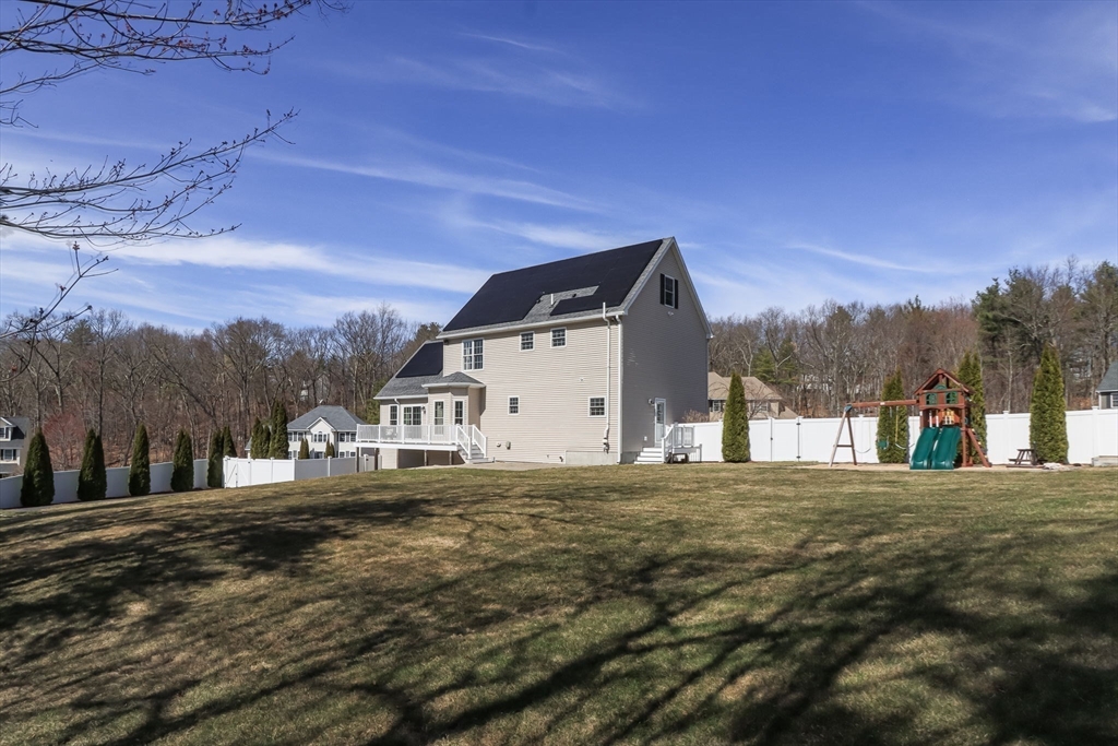16 Mountain Laurel Road Ayer, MA 01432 - Photo 34 of 39 a front view of a house with a yard