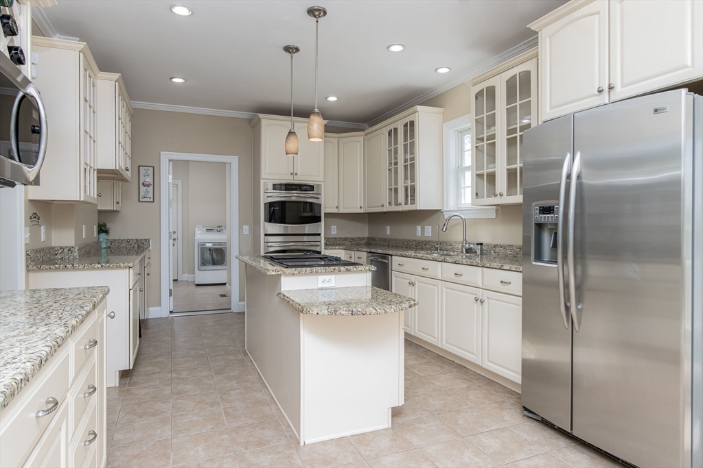 16 Mountain Laurel Road Ayer, MA 01432 - Photo 10 of 39 a kitchen with stainless steel appliances granite countertop a refrigerator a stove and a sink