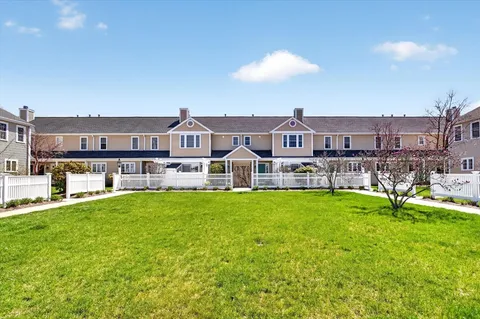 a view of a big yard with a large garden and plants