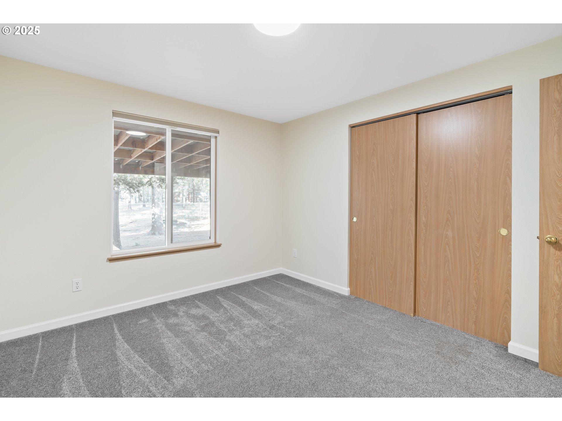 15711 Deedon Lane La Pine, OR 97739 - Photo 11 of 29 a view of an empty room with a window