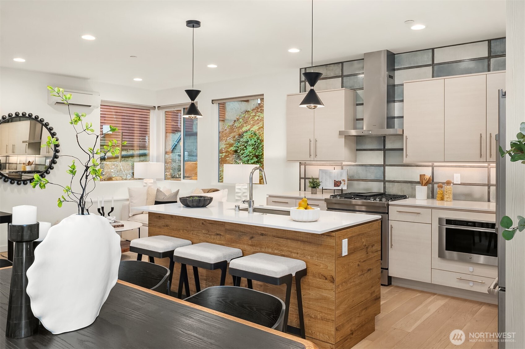2617 3rd Avenue West Seattle, WA 98119 - Photo 12 of 30 a kitchen with stainless steel appliances granite countertop a sink a stove and a refrigerator
