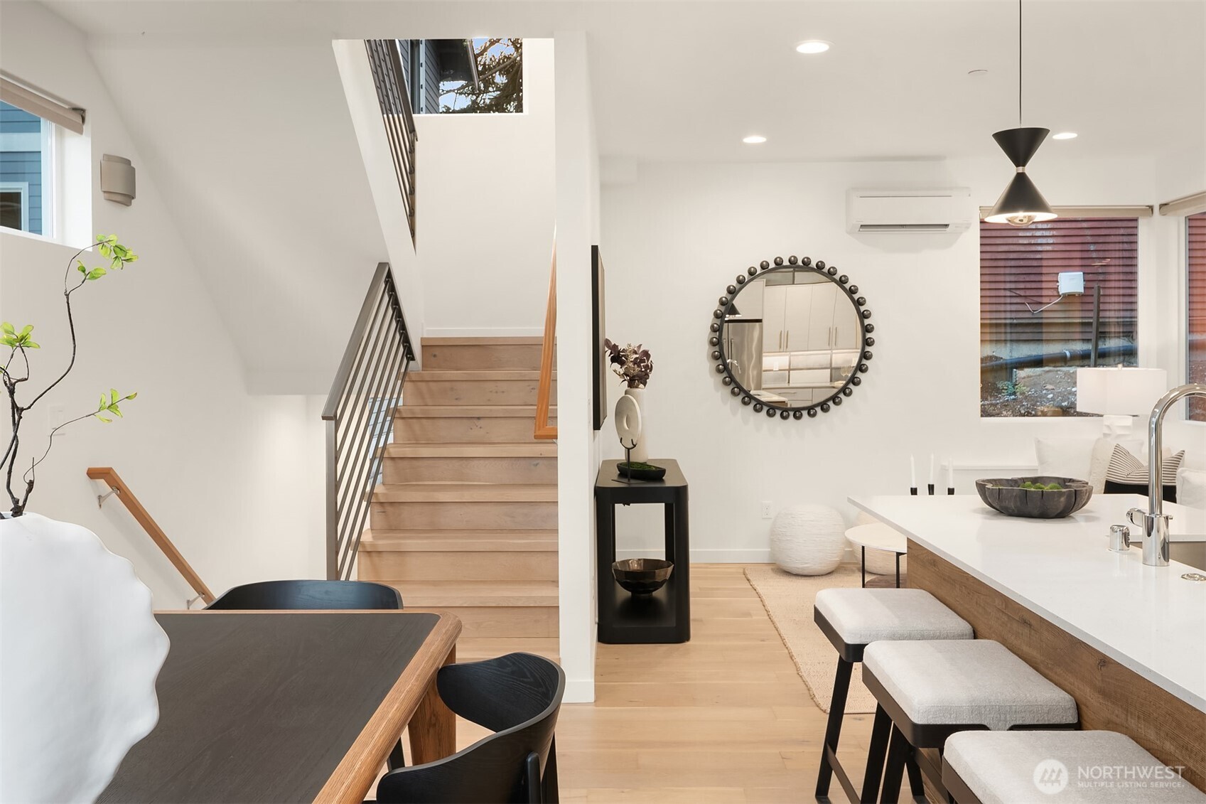 2617 3rd Avenue West Seattle, WA 98119 - Photo 14 of 30 a living room with furniture a rug and white walls