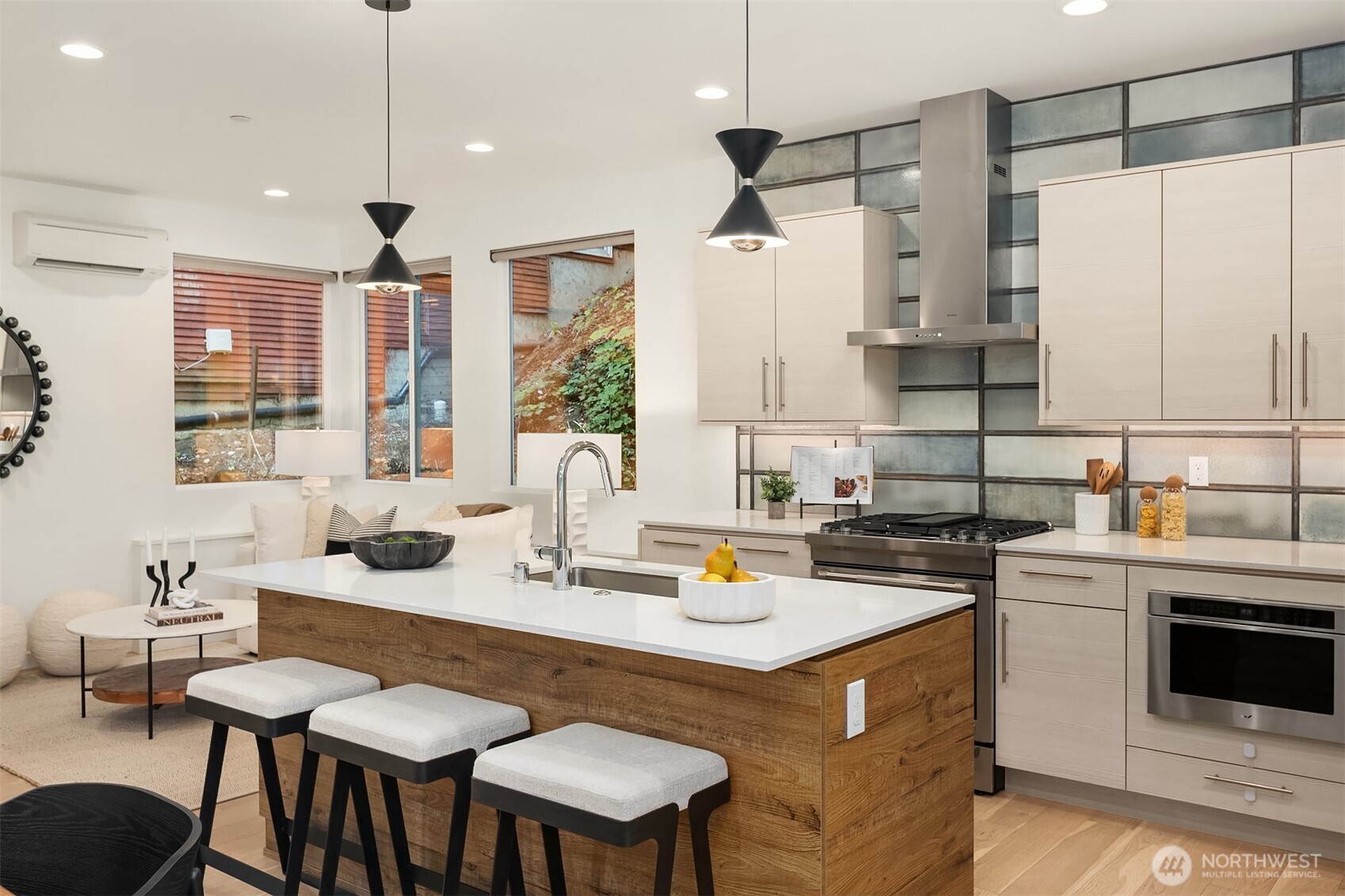 2617 3rd Avenue West Seattle, WA 98119 - Photo 16 of 30 a kitchen with a stove a refrigerator a sink dishwasher with a dining table and chairs