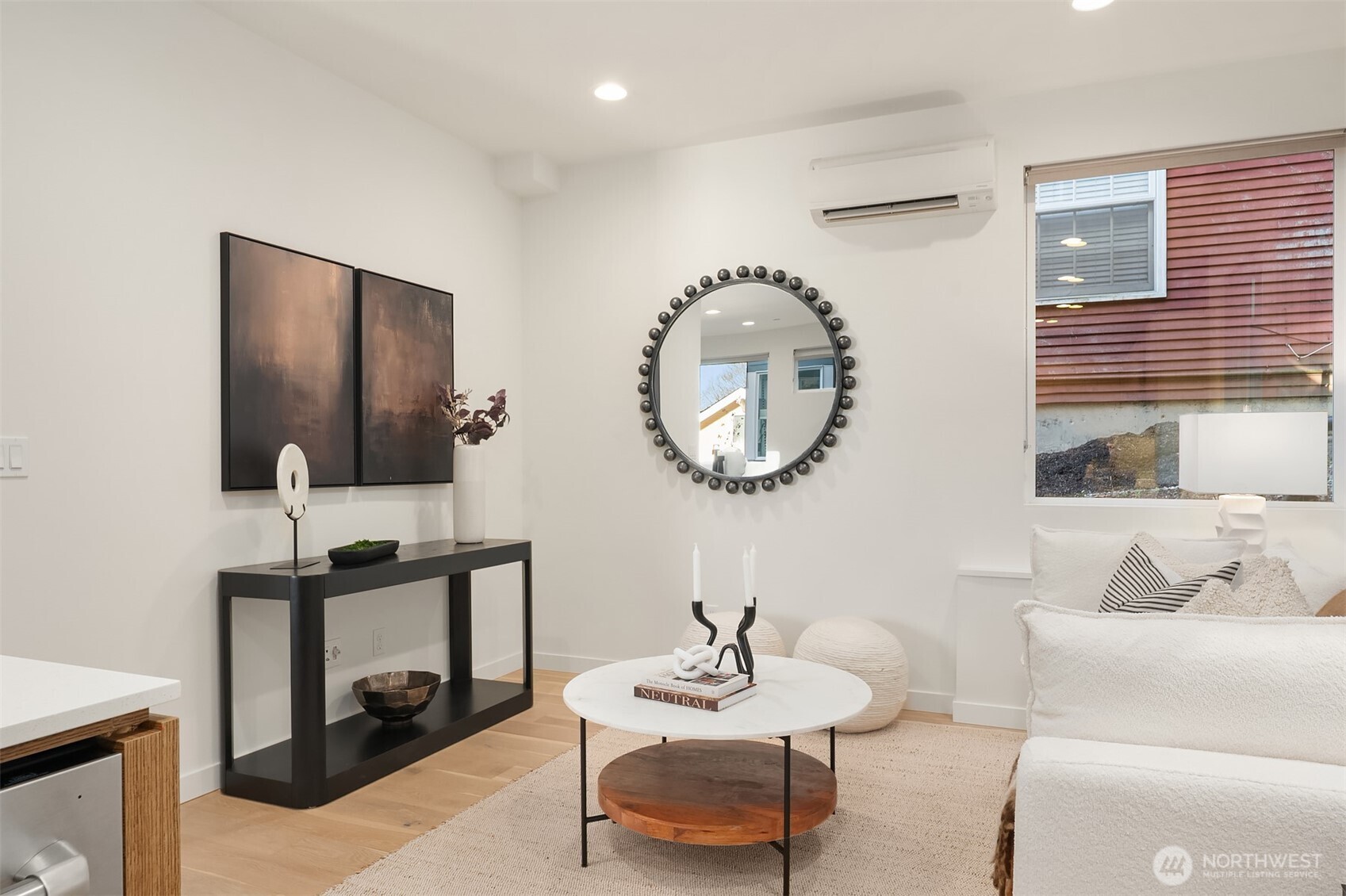 2617 3rd Avenue West Seattle, WA 98119 - Photo 18 of 30 a living room with furniture and a mirror